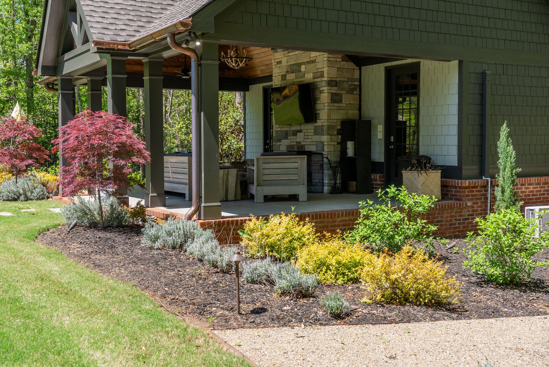 Fresh plant installation with layered garden beds and stone edging